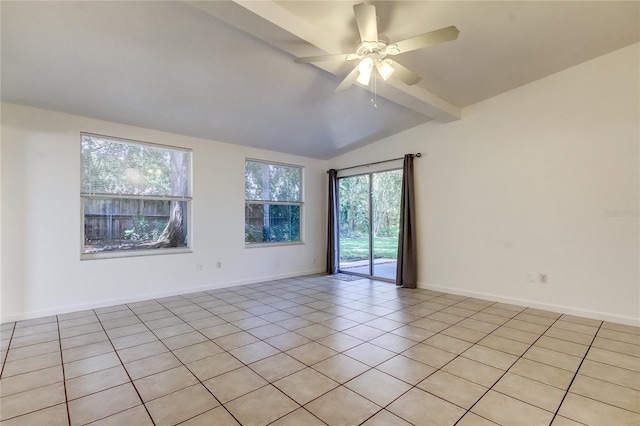 unfurnished room featuring light tile patterned floors, lofted ceiling with beams, and a wealth of natural light