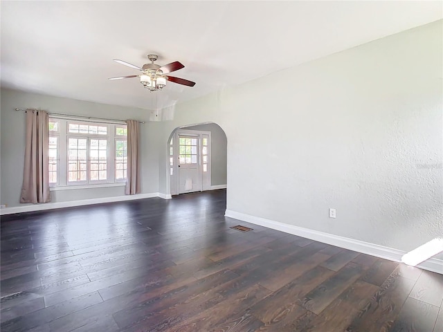 unfurnished room featuring ceiling fan and dark hardwood / wood-style floors