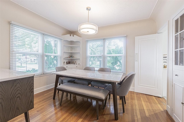 dining space with light wood-type flooring