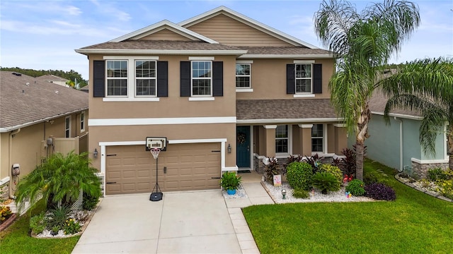 view of front of house featuring a front yard and a garage