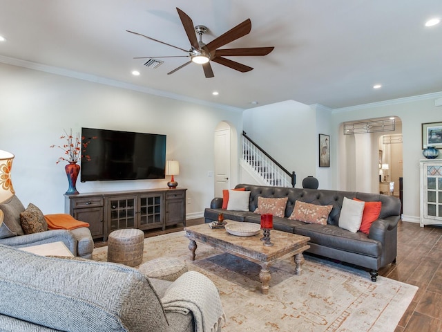 living room with ornamental molding, hardwood / wood-style floors, and ceiling fan