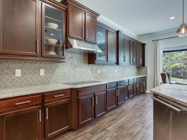 kitchen featuring dishwasher, tasteful backsplash, hanging light fixtures, dark hardwood / wood-style flooring, and ornamental molding