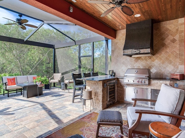 view of patio with area for grilling, beverage cooler, ceiling fan, and an outdoor kitchen