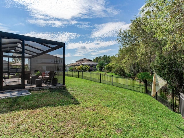 view of yard with a lanai and a patio