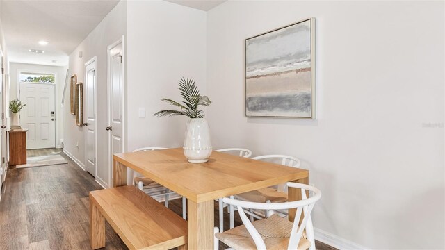 dining area featuring dark hardwood / wood-style floors