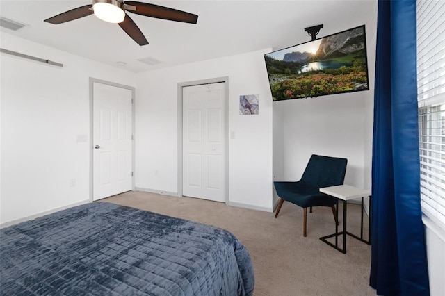 bedroom with ceiling fan and carpet