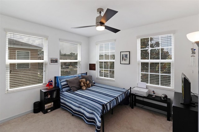 bedroom with ceiling fan and carpet floors