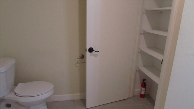 3225 Oakland Rd N, Lakeland, FL 33801 - bathroom with toilet, tile patterned floors, and baseboards
