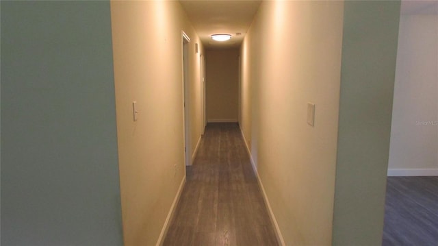 3225 Oakland Rd N, Lakeland, FL 33801 - hall with dark wood-style flooring and baseboards