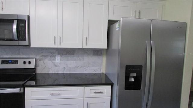 3225 Oakland Rd N, Lakeland, FL 33801 - kitchen featuring white cabinetry, backsplash, and stainless steel appliances