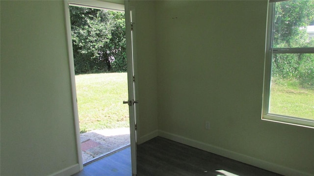 3225 Oakland Rd N, Lakeland, FL 33801 - doorway featuring dark wood-type flooring and baseboards