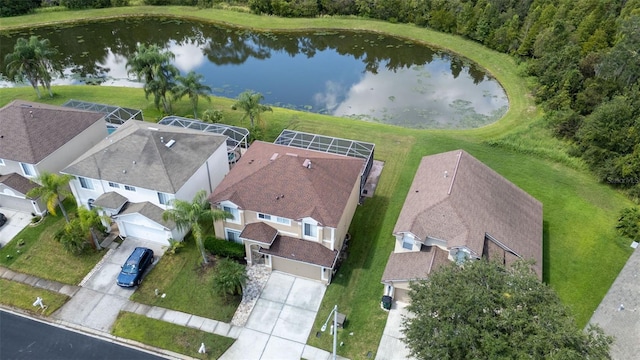 birds eye view of property with a water view