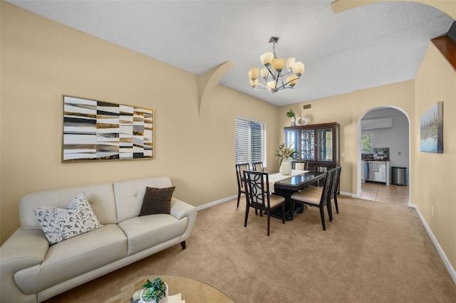 dining space with light carpet, an inviting chandelier, and plenty of natural light