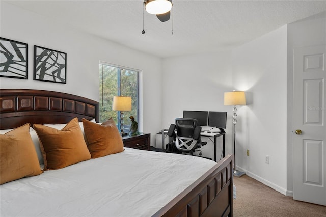 bedroom with ceiling fan and light colored carpet