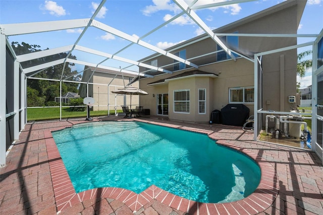 view of swimming pool with area for grilling, a lanai, and a patio