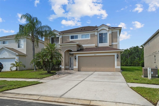 view of front facade with a front yard and a garage