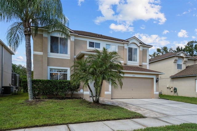 view of front of house featuring cooling unit, a front yard, and a garage