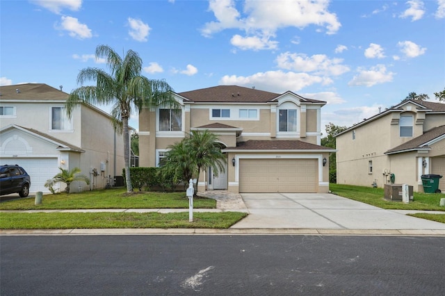 front of property featuring a garage and a front lawn