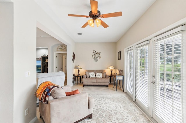 sitting room featuring ceiling fan