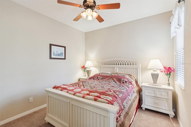 bedroom featuring light carpet and ceiling fan