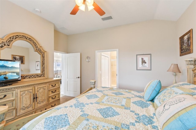 bedroom with ensuite bath, lofted ceiling, and ceiling fan