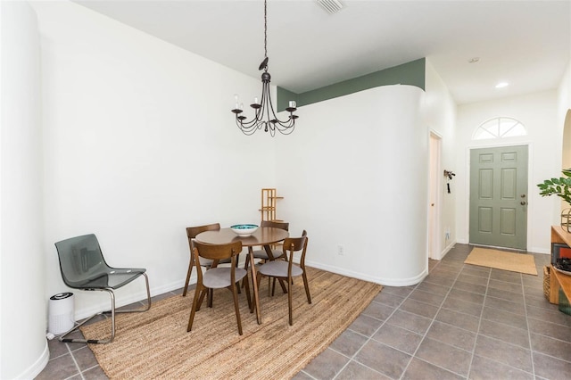 dining area featuring a notable chandelier