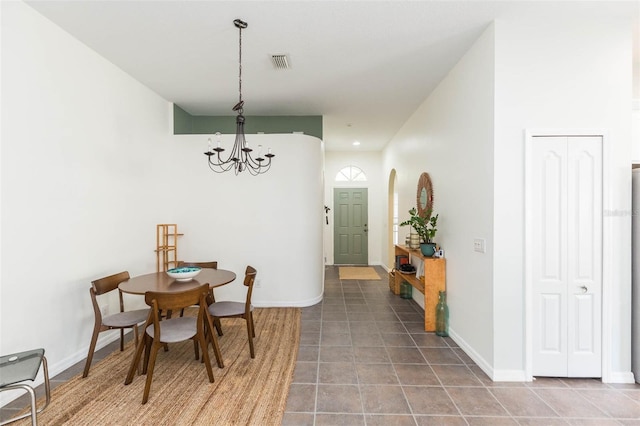 dining area featuring an inviting chandelier