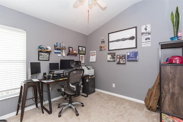 home office featuring light carpet, ceiling fan, and lofted ceiling