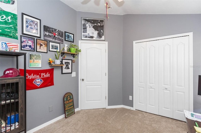 playroom featuring carpet, ceiling fan, and lofted ceiling