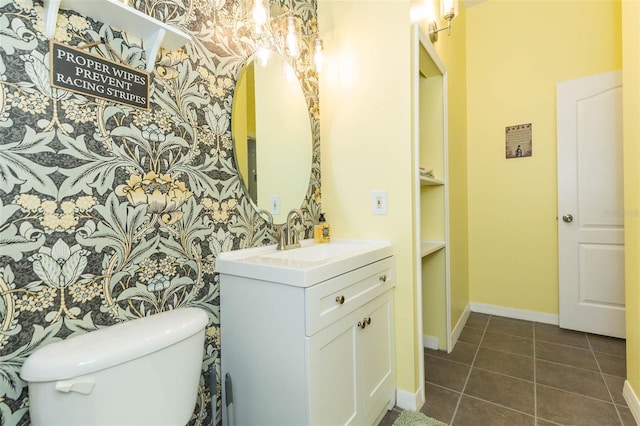 bathroom with tile patterned floors, vanity, and toilet