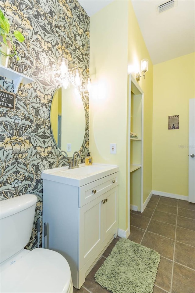 bathroom with vanity and toilet