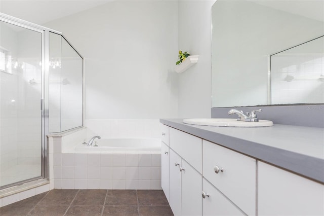 bathroom featuring vanity and shower with separate bathtub