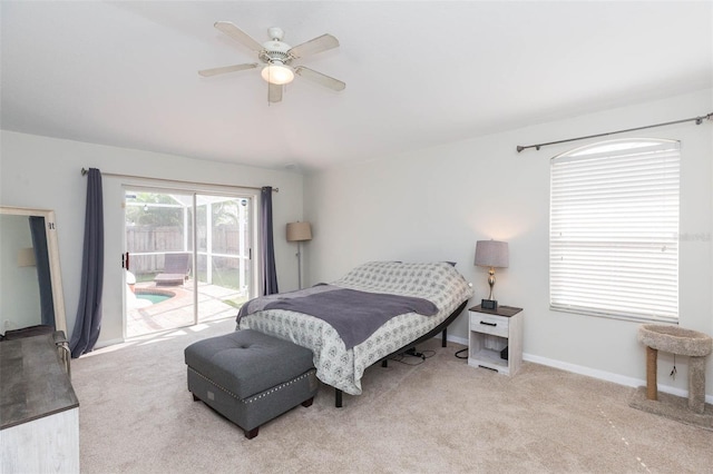 bedroom with access to exterior, ceiling fan, and light carpet