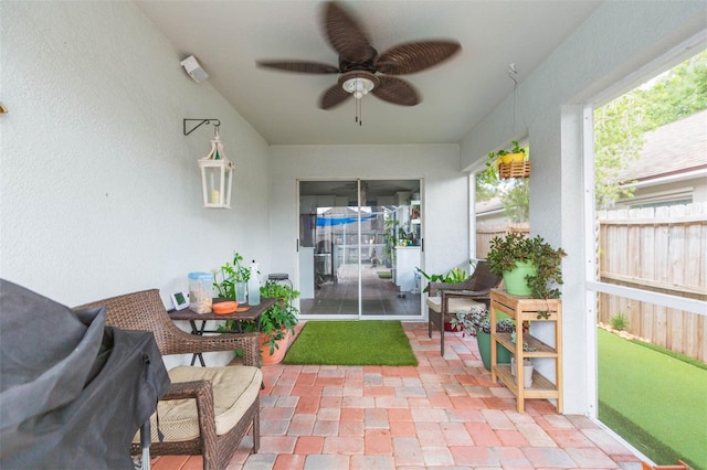 view of patio / terrace featuring ceiling fan