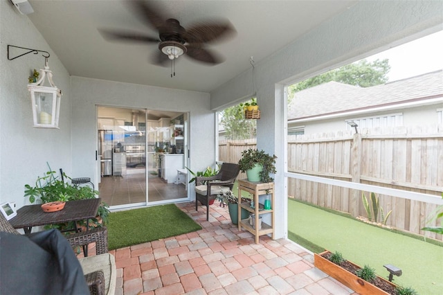 view of patio featuring ceiling fan