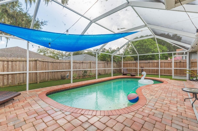 view of pool with a lanai and a patio area