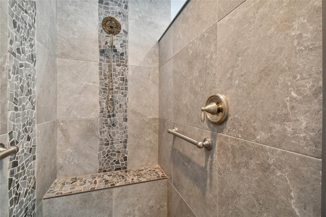 bathroom with tiled shower