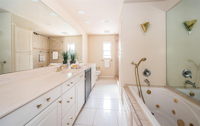 full bathroom featuring tile patterned floors, independent shower and bath, vanity, and toilet