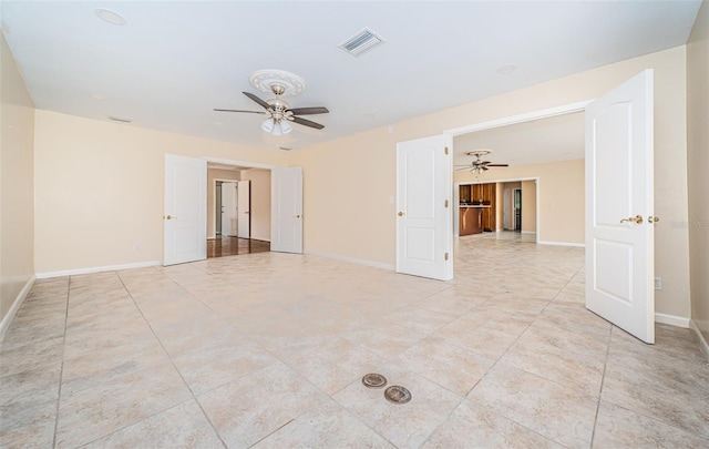 unfurnished room featuring ceiling fan