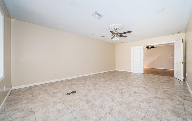 unfurnished room featuring ceiling fan