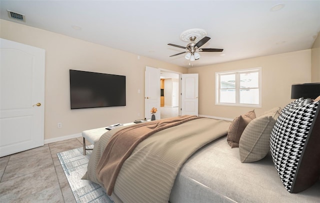 bedroom featuring ceiling fan and light tile patterned floors