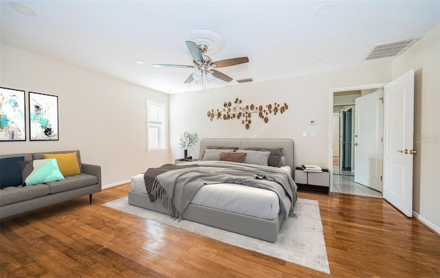 bedroom featuring ceiling fan and hardwood / wood-style floors