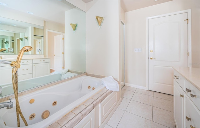 bathroom featuring vanity, a bathing tub, and tile patterned floors