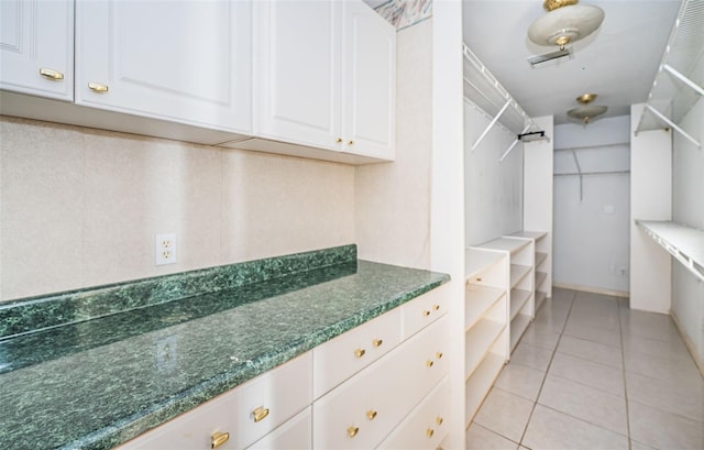 walk in closet featuring light tile patterned floors