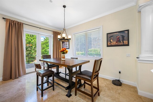 dining space featuring an inviting chandelier and ornamental molding