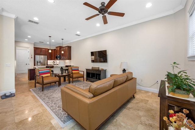 living room featuring ceiling fan and ornamental molding