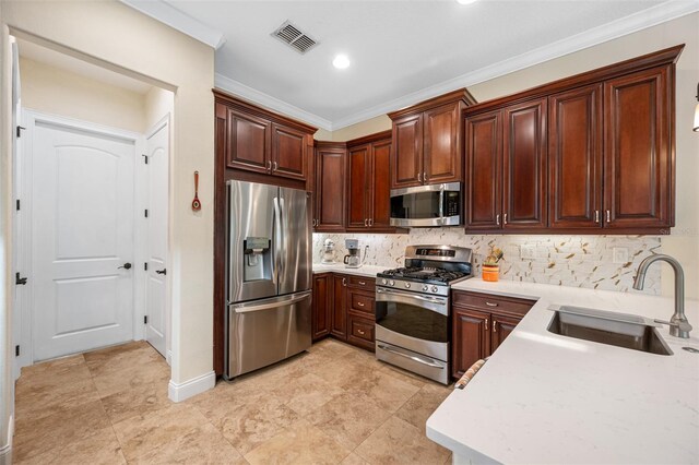 kitchen featuring appliances with stainless steel finishes, ornamental molding, sink, and tasteful backsplash