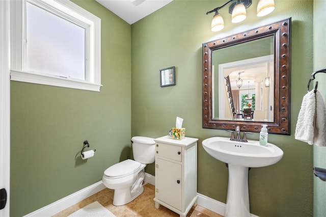 bathroom featuring toilet and tile patterned floors