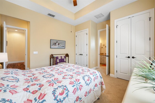 carpeted bedroom with ceiling fan