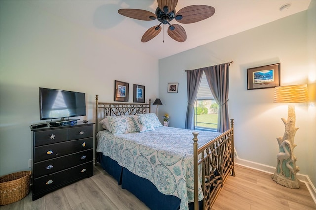 bedroom with light wood-type flooring and ceiling fan